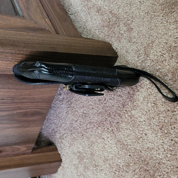 - Coach wristlet black super cute large enough for phone. - Picture 15 of 16